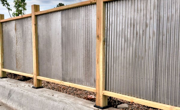 Corrugated metal fence